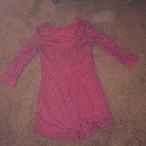 A maroon printed short dress with long sleeves